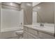 Clean bathroom with single vanity, shower/tub combo, and toilet at 8486 Insignia Ave # 101, Las Vegas, NV 89178