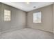 Well-lit bedroom with neutral walls, carpeting, and ample closet space at 8486 Insignia Ave # 101, Las Vegas, NV 89178