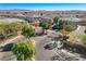 Aerial view of community gated entrance with landscaping at 8486 Insignia Ave # 101, Las Vegas, NV 89178