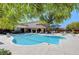 Community pool with a relaxing atmosphere and shaded seating areas at 8486 Insignia Ave # 101, Las Vegas, NV 89178