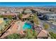 Community pool and spa with surrounding homes at 8486 Insignia Ave # 101, Las Vegas, NV 89178