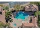 Community pool and spa with lounge chairs at 8486 Insignia Ave # 101, Las Vegas, NV 89178