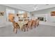 Formal dining room with seating for twelve and kitchen views at 9032 Park Forest Ct, Las Vegas, NV 89134