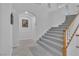 Bright entryway with tiled floors and a staircase leading to the second floor at 9032 Park Forest Ct, Las Vegas, NV 89134