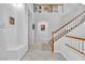 Grand entryway with tiled floors and a curved staircase at 9032 Park Forest Ct, Las Vegas, NV 89134