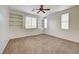 Bright bedroom with ceiling fan and built-in shelving at 10079 S Riley St, Las Vegas, NV 89178