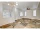 Sunlit dining room with tile floors and window blinds at 10079 S Riley St, Las Vegas, NV 89178