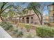 Two-story house with front yard landscaping and a brown fence at 10079 S Riley St, Las Vegas, NV 89178