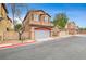 Two-story house with attached garage and landscaping at 10079 S Riley St, Las Vegas, NV 89178