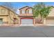 Two-story house with attached garage at 10079 S Riley St, Las Vegas, NV 89178