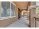 Covered porch with tiled flooring and a security screen door at 10079 S Riley St, Las Vegas, NV 89178