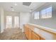 Bright hallway with two bedrooms and built-in cabinets at 10079 S Riley St, Las Vegas, NV 89178