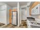 Kitchen features stainless steel refrigerator and tile floor at 10079 S Riley St, Las Vegas, NV 89178