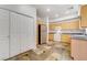 Kitchen with stainless steel refrigerator and wood cabinets at 10079 S Riley St, Las Vegas, NV 89178