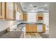 Modern kitchen featuring wood cabinets and tile flooring at 10079 S Riley St, Las Vegas, NV 89178