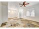 Bright living room featuring tile floors and ceiling fan at 10079 S Riley St, Las Vegas, NV 89178