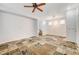 Spacious living room with tile floors and staircase at 10079 S Riley St, Las Vegas, NV 89178