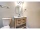 Updated bathroom with a modern vanity and mirror at 104 Temple Dr, Las Vegas, NV 89107