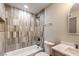 Updated bathroom with grey tile shower and a light wood vanity at 104 Temple Dr, Las Vegas, NV 89107