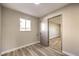 Light and airy bedroom with wood-look flooring at 104 Temple Dr, Las Vegas, NV 89107