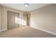 Bright bedroom with carpet and access to a full bathroom at 104 Temple Dr, Las Vegas, NV 89107