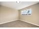 Simple bedroom with carpet and window at 104 Temple Dr, Las Vegas, NV 89107