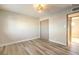 Well-lit bedroom with wood-look floors and ample closet space at 104 Temple Dr, Las Vegas, NV 89107