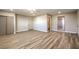 Bright bedroom with wood-look floors and access to a private bathroom at 104 Temple Dr, Las Vegas, NV 89107