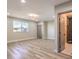 Spacious bedroom featuring wood-look floors and an ensuite bathroom at 104 Temple Dr, Las Vegas, NV 89107