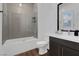 Modern bathroom with a large shower and gray tile at 11903 Sandstone Arch Dr, Las Vegas, NV 89138