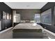 Main bedroom with grey platform bed and dark walls at 11903 Sandstone Arch Dr, Las Vegas, NV 89138