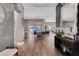 Open concept dining room with modern chandelier and hardwood floors at 11903 Sandstone Arch Dr, Las Vegas, NV 89138