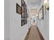 Bright hallway with framed photos and neutral decor at 11903 Sandstone Arch Dr, Las Vegas, NV 89138