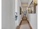 Bright hallway with hardwood floors and picture gallery at 11903 Sandstone Arch Dr, Las Vegas, NV 89138