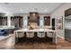 Modern kitchen featuring a large island and dark wood cabinets at 11903 Sandstone Arch Dr, Las Vegas, NV 89138