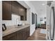 Modern kitchenette with stainless steel appliances and cabinetry at 11903 Sandstone Arch Dr, Las Vegas, NV 89138