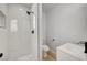 Modern bathroom with walk-in shower, marble tile and floating vanity at 1208 Marion Dr, Las Vegas, NV 89110