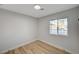 Bright bedroom with window and wood-look floors at 1208 Marion Dr, Las Vegas, NV 89110