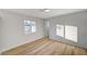 Bright bedroom with wood-look flooring and a window at 1208 Marion Dr, Las Vegas, NV 89110