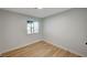 Spacious bedroom featuring light walls and wood-look floors at 1208 Marion Dr, Las Vegas, NV 89110