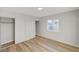 Bedroom with light gray walls, wood-look floors, and double closets at 1208 Marion Dr, Las Vegas, NV 89110