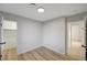 Spacious bedroom with light walls and wood-look floors at 1208 Marion Dr, Las Vegas, NV 89110