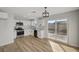 Bright kitchen featuring white shaker cabinets, stainless steel appliances, and vinyl flooring at 1208 Marion Dr, Las Vegas, NV 89110