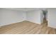 Spacious living area with light gray walls and wood-look flooring at 1208 Marion Dr, Las Vegas, NV 89110