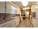 Kitchen with light cabinets, laminate floor, and a pantry at 1229 S 9Th St, Las Vegas, NV 89104