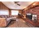 Living room featuring a brick fireplace and comfy sectional sofa at 1229 S 9Th St, Las Vegas, NV 89104