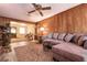 Open living room with a view into the dining area and comfy sectional at 1229 S 9Th St, Las Vegas, NV 89104