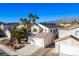 Two-story house with tile roof, attached garage, and mountain views at 1608 Council Bluff Ln, North Las Vegas, NV 89031