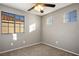 Simple bedroom with ceiling fan and carpet flooring at 1608 Council Bluff Ln, North Las Vegas, NV 89031