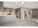 Modern kitchen with gray cabinets and stainless steel appliances at 1608 Council Bluff Ln, North Las Vegas, NV 89031